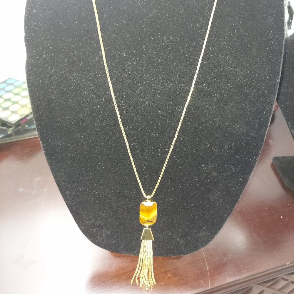 Gold necklace with citrine gemstone and tassel detail